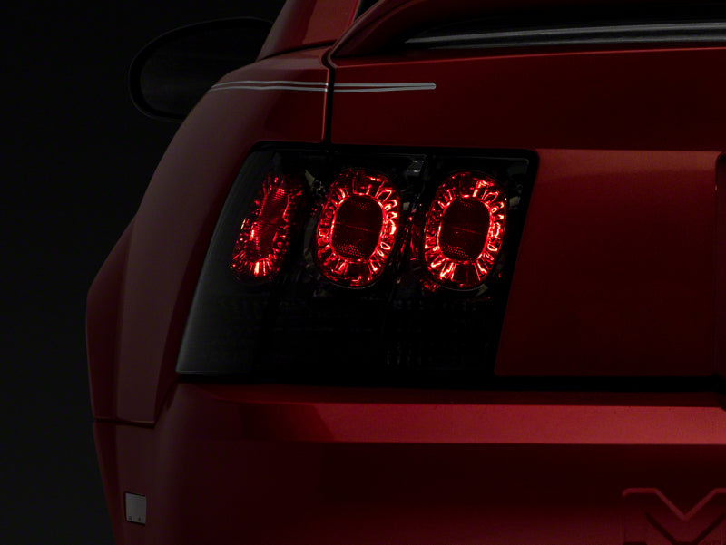 Raxiom 99-04 Ford Mustang Axial Series Altezza Style Tail Lights- Black Housing (Smoked Lens)