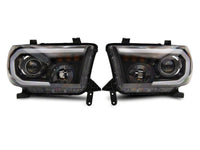 Raxiom 07-13 Toyota Tundra Axial Projector Headlights w/ SEQL LED Bar- Black Housing (Clear Lens)