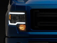 Raxiom 09-14 Ford F-150 Axial Series Headlights w/ LED Bar- Black Housing (Clear Lens)