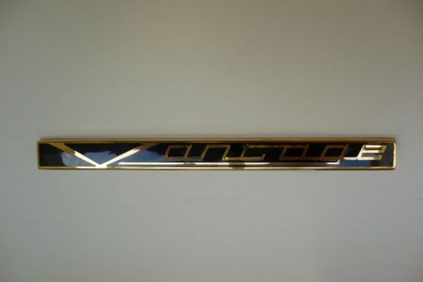 Aston Martin 095-078-0010 Vantage Badge Gold and Black |