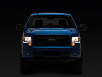 Raxiom 09-14 Ford F-150 Axial Series Headlights w/ LED Bar- Black Housing (Clear Lens)