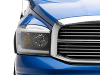 Raxiom 06-09 Dodge RAM 1500/2500/3500 Axial Headlights w/ SEQL LED Bar- Black Housing (Clear Lens)