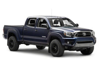 Raxiom 12-15 Toyota Tacoma Axial Projector Headlights w/ SEQL LED Bar- Black Housing (Clear Lens)