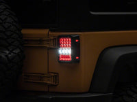 Raxiom 07-18 Jeep Wrangler JK Axial Series Lux LED Tail Lights- Black Housing (Clear Lens)