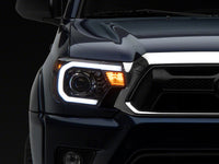 Raxiom 12-15 Toyota Tacoma Axial Projector Headlights w/ SEQL LED Bar- Black Housing (Clear Lens)