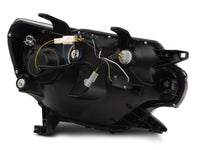 Raxiom 12-15 Toyota Tacoma Axial Projector Headlights w/ SEQL LED Bar- Black Housing (Clear Lens)