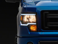 Raxiom 09-14 Ford F-150 Axial Series Headlight w/ SEQL LED Bar- Black Housing (Clear Lens)