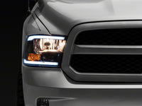 Raxiom 09-18 Dodge RAM 1500/2500/3500 Axial Series Headlights w/ LED Bar- Black Housing (Clear Lens)