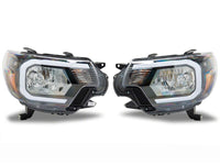 Raxiom 12-15 Toyota Tacoma Axial Series Headlights/Seq LED Bar- Black- Clear Lens