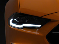 Raxiom 18-23 Ford Mustang GT EcoBoost LED Projector Headlights- Black Housing (Clear Lens)