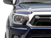 Raxiom 12-15 Toyota Tacoma Axial Series Projector Headlights w/ LED Bar- Black Housing (Clear Lens)