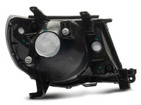 Raxiom 05-11 Toyota Tacoma Axial Series OE Replacement Headlights- Black Housing (Clear Lens)