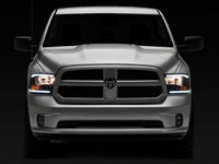 Raxiom 09-18 Dodge RAM 1500/2500/3500 Axial Series Headlights w/ LED Bar- Black Housing (Clear Lens)