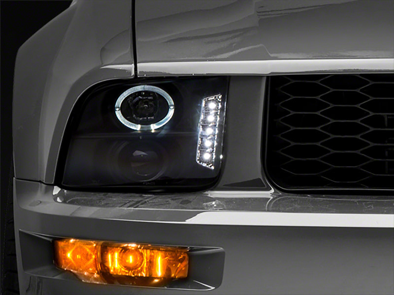 Raxiom 05-09 Ford Mustang Excluding GT500 LED Halo Projector Headlights- Black Housing (Clear Lens)