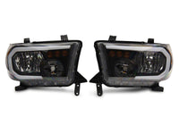 Raxiom 07-13 Toyota Tundra Axial Series Headlights w/ LED Bar- Black Housing (Clear Lens)