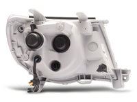 Raxiom 05-11 Toyota Tacoma Axial Series LED DRL Projector Headlights- Black Housing (Clear Lens)