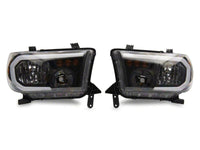 Raxiom 07-13 Toyota Tundra Axial Series Headlights w/ SEQL LED Bar- Black Housing (Clear Lens)