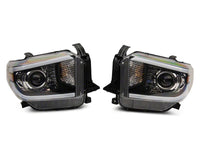 Raxiom 14-21 Toyota Tundra Axial Projector Headlights w/ SEQL LED Bar- Black Housing (Clear Lens)