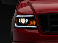 Raxiom 04-08 Ford F-150 Axial Series Projector Headlights w/ SEQL LED Bar- Blk Housing (Clear Lens)