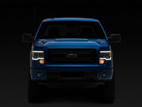 Raxiom 09-14 Ford F-150 Axial Series Headlights w/ LED Bar- Black Housing (Clear Lens)