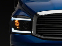 Raxiom 06-09 Dodge RAM 1500/2500/3500 Axial Headlights w/ SEQL LED Bar- Black Housing (Clear Lens)