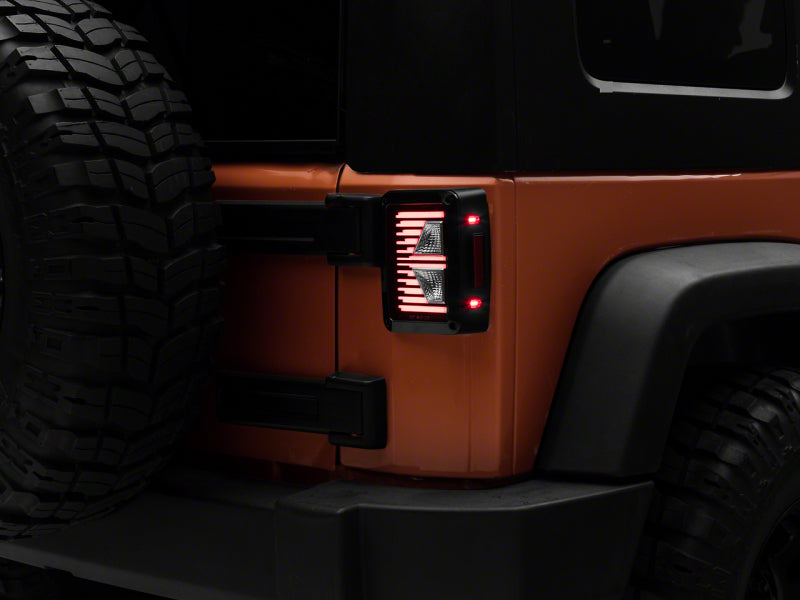 Raxiom 07-18 Jeep Wrangler JK Axial Series Vision LED Tail Lights- Black Housing (Clear Lens)