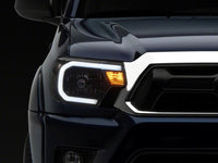 Raxiom 12-15 Toyota Tacoma Axial Series Headlights w/ LED Bar- Black Housing (Clear Lens)
