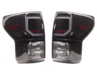 Raxiom 07-13 Toyota Tundra Axial Series Dual C-Shape LED Tail Lights- Black Housing- Smoked Lens