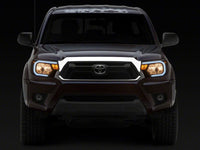 Raxiom 12-15 Toyota Tacoma Axial Series Headlights w/ LED Bar- Black Housing (Clear Lens)