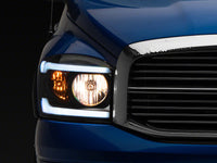 Raxiom 06-09 Dodge RAM 1500/2500/3500 Axial Headlights w/ SEQL LED Bar- Black Housing (Clear Lens)